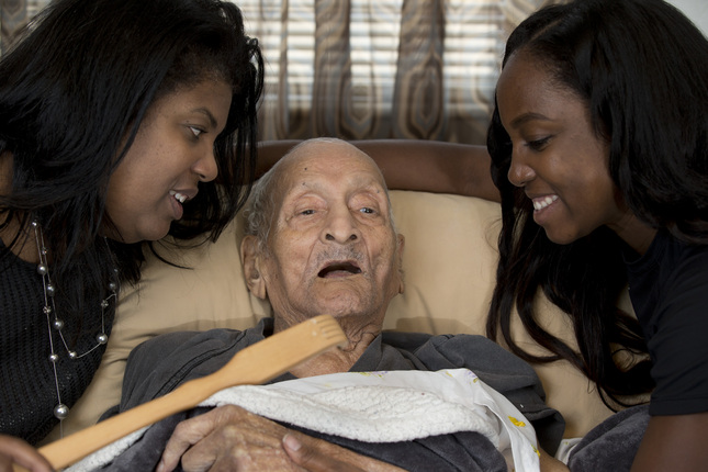 Andrew Hatch, who will celebrate his 117th birthday on Wednesday, poses for a photograph with his daughter Delane Sims, left, and granddaughter SherriAnn Cole, at his Oakland, Calif. home, Tuesday, Oct. 6, 2015. Hatch, who was born in 1898, when William McKinley was President of the 45 United States, will be feted by his family with a "backscratching" birthday party. (D. Ross Cameron/Bay Area News Group)