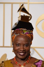 Angelique Kidjo poses with her Best World Music Album trophy for "Sings" in the press room during the 58th Annual Grammy Music Awards in Los Angeles on February 15, 2016. AFP PHOTO / MARK RALSTON / AFP / MARK RALSTON