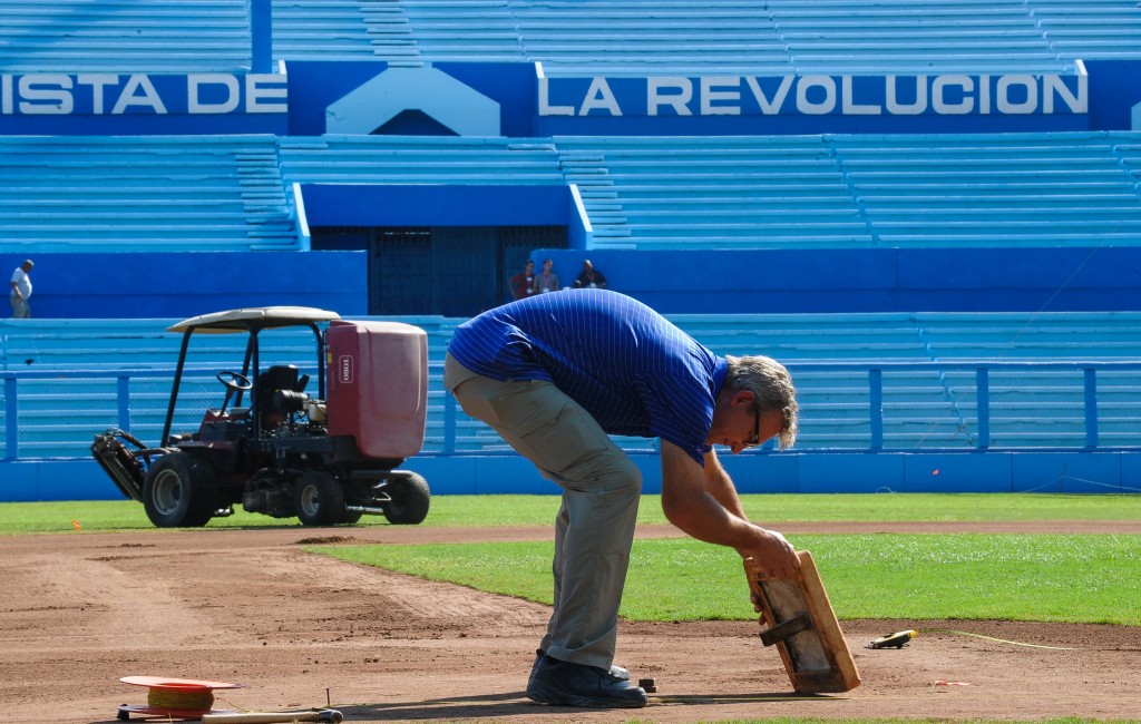 A man takes part in repair works of the Latinoamericano stadium in Havana, on March 13, 2016. Cubans look forward to the baseball game between the US Tampa Bay Rays team and the Cuban team, which will take place on March 22, with the presence of US President Barack Obama.     AFP PHOTO/ YAMIL LAGE / AFP / YAMIL LAGE