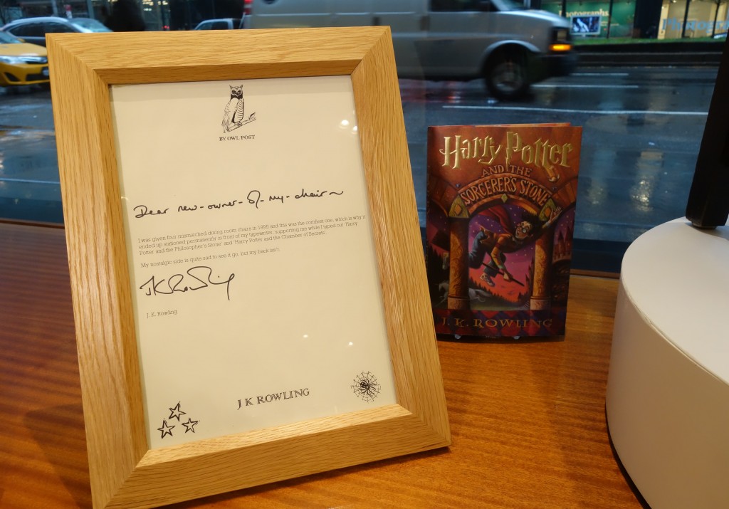 A chair used, and later decorated, by author J.K. Rowling while she wrote the first two Harry Potter books on display alongside a letter of provenance from the author at Heritage Auctions in New York on April 4 2016 ahead of its sale on April 6.                                 / AFP / William EDWARDS