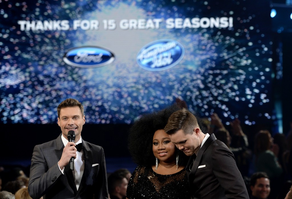 HOLLYWOOD, CALIFORNIA - APRIL 07: American Idol Season 15 winner Trent Harmon (R), host Ryan Seacrest (L) and finalist La'Porsha Renae speak onstage during FOX's "American Idol" Finale For The Farewell Season at Dolby Theatre on April 7, 2016 in Hollywood, California. at Dolby Theatre on April 7, 2016 in Hollywood, California.   Kevork Djansezian/Getty Images/AFP