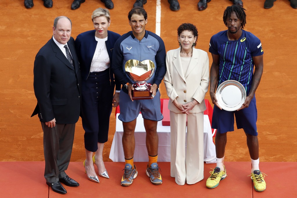 (LtoR) Prince Albert II of Monaco, Princess Charlene of Monaco, Spain's Rafael Nadal, Elisabeth Anne de Massy and France's Gael Monfils pose after the final tennis match at the Monte-Carlo ATP Masters Series Tournament in Monaco on April 17, 2016. Nadal defeated Monfils 7-5, 5-7, 6-0 to win a record ninth title at the Monte Carlo Masters.  AFP PHOTO / VALERY HACHE / AFP PHOTO / VALERY HACHE
