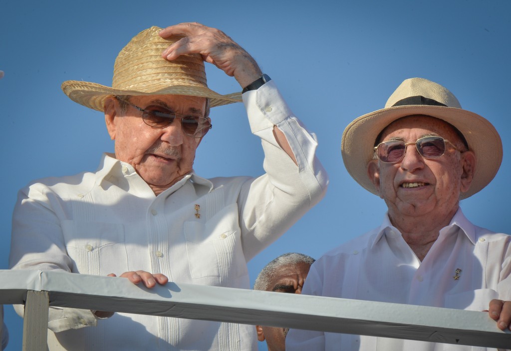 Cuban President Raul Castro (L) and Vice-President Jose Ramon Machado Ventura attend the May Day parade at Revolution Square in Havana, on May 1, 2016. / AFP PHOTO / ADALBERTO ROQUE