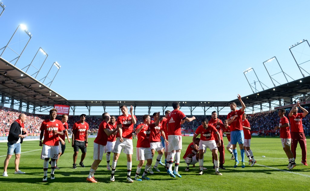 Bayern Munich players celebrate wining the league for the fourth year in a row after the German first division Bundesliga football match between FC Ingolstadt 04 and FC Bayern Munich, at the Audi Sportpark in Ingolstadt, southern Germany, on May 7, 2016. / AFP PHOTO / CHRISTOF STACHE / RESTRICTIONS: DURING MATCH TIME: DFL RULES TO LIMIT THE ONLINE USAGE TO 15 PICTURES PER MATCH AND FORBID IMAGE SEQUENCES TO SIMULATE VIDEO. == RESTRICTED TO EDITORIAL USE == FOR FURTHER QUERIES PLEASE CONTACT DFL DIRECTLY AT + 49 69 650050