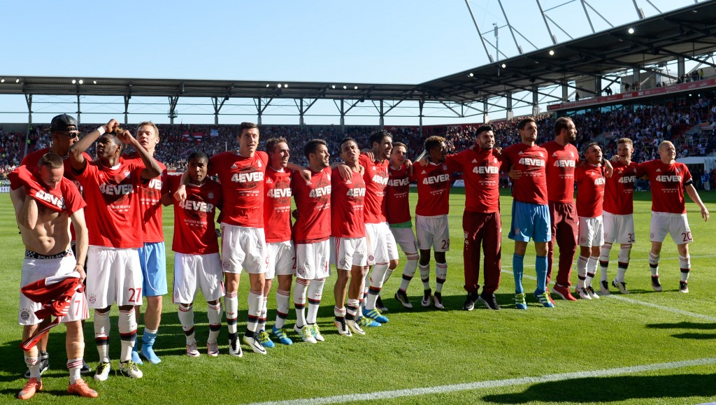 Bayern Munich players celebrate wining the league for the fourth year in a row after the German first division Bundesliga football match between FC Ingolstadt 04 and FC Bayern Munich, at the Audi Sportpark in Ingolstadt, southern Germany, on May 7, 2016. / AFP PHOTO / CHRISTOF STACHE / RESTRICTIONS: DURING MATCH TIME: DFL RULES TO LIMIT THE ONLINE USAGE TO 15 PICTURES PER MATCH AND FORBID IMAGE SEQUENCES TO SIMULATE VIDEO. == RESTRICTED TO EDITORIAL USE == FOR FURTHER QUERIES PLEASE CONTACT DFL DIRECTLY AT + 49 69 650050