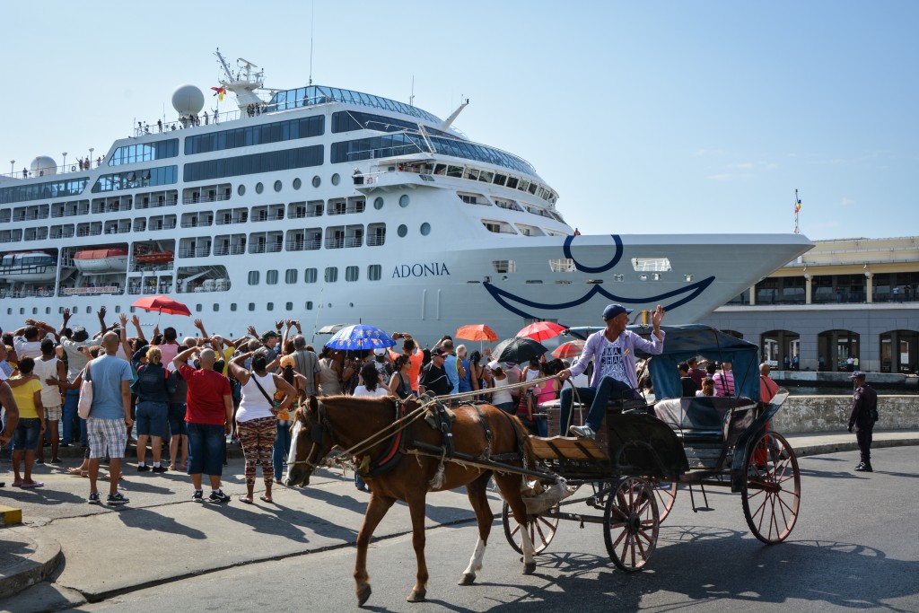 The first US-to-Cuba cruise ship to arrive in the island nation in decades remains docked at the port of Havana, on May 2, 2016.  The first US cruise ship bound for Cuba in half a century, the Adonia -- a vessel from the Carnival cruise's Fathom line -- set sail from Florida on Sunday, marking a new milestone in the rapprochement between Washington and Havana. The ship -- with 700 passengers aboard -- departed from Miami, the heart of the Cuban diaspora in the United States. / AFP PHOTO / JORGE BELTRAN
