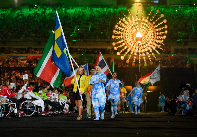The Swedish flag bearer Fia Fjelddahl enters the arena during the closing ceremony of the Rio 2016 Paralympic Games at the Maracana Stadium in Rio de Janeiro, Brazil on September 18, 2016. Handout photo by Thomas Lovelock for OIS/IOC via AFP. RESTRICTED TO EDITORIAL USE / AFP PHOTO / Thomas Lovelock for OIS/IOC / RESTRICTED TO EDITORIAL USE.