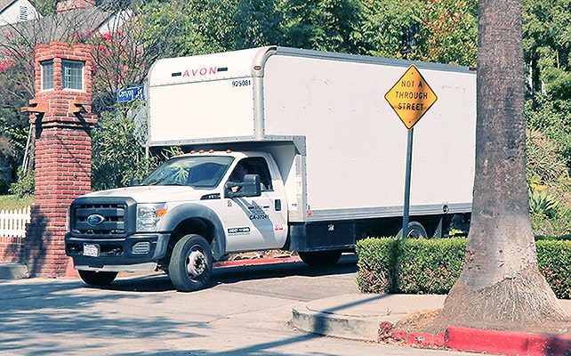 Photo © 2016 INF/The Grosby Group Los Angeles, September 21, 2016 A Enterprise moving truck gets a Police escort at Brad and Angelina's house as reporters get video, after Angelina Jolie files for divorce from Brad Pitt.
