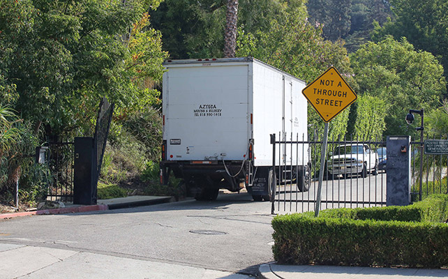 Photo © 2016 AKM GSI/The Grosby Group Los Angeles, September 21, 2016 A Enterprise moving truck gets a Police escort at Brad and Angelina's house as reporters get video, after Angelina Jolie files for divorce from Brad Pitt.