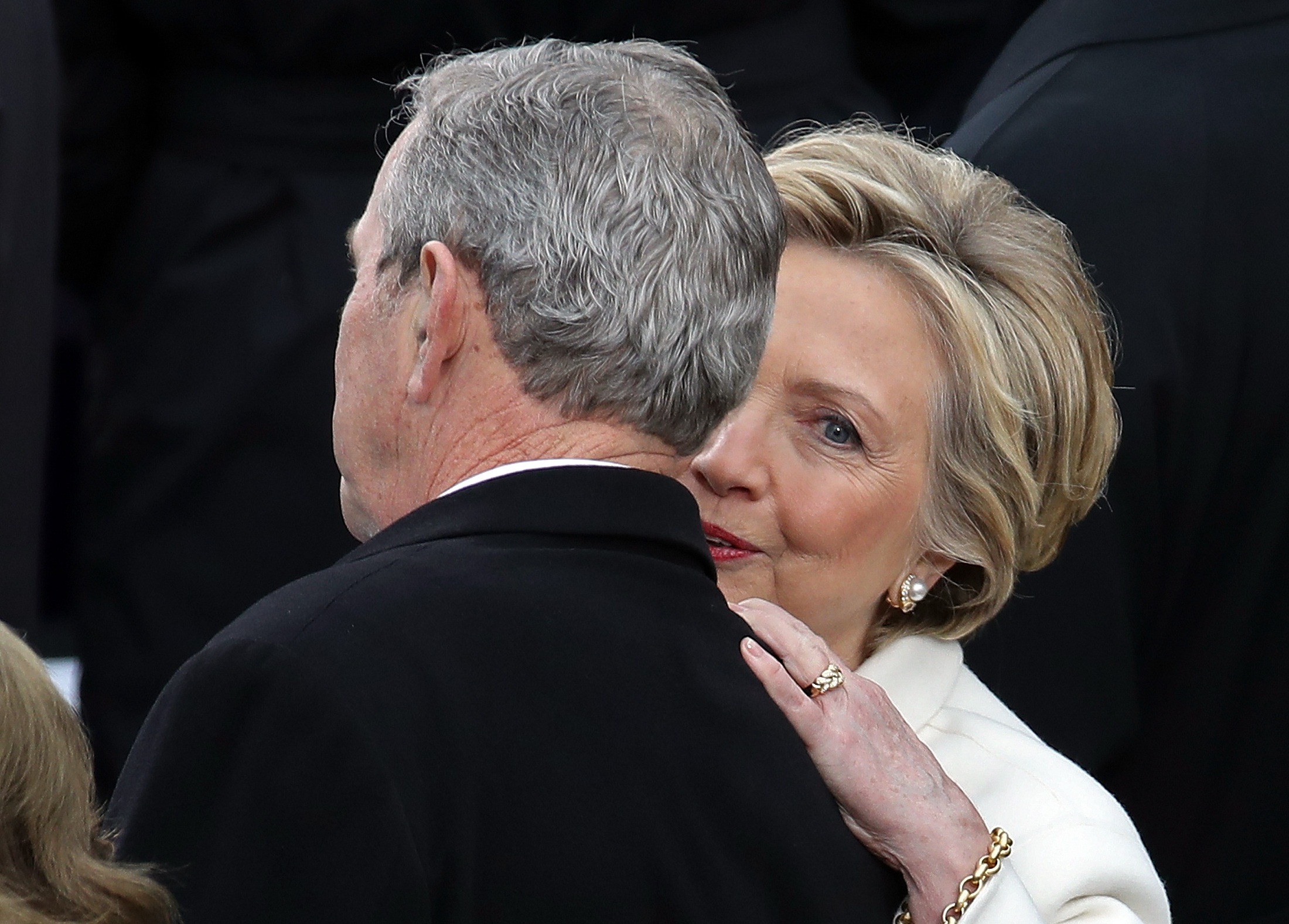 WASHINGTON, DC - JANUARY 20: Former Democratic presidential nominee Hillary Clinton (R) talks to former President George W. Bush arrives on the West Front of the U.S. Capitol on January 20, 2017 in Washington, DC. In today's inauguration ceremony Donald J. Trump becomes the 45th president of the United States.   Drew Angerer/Getty Images/AFP