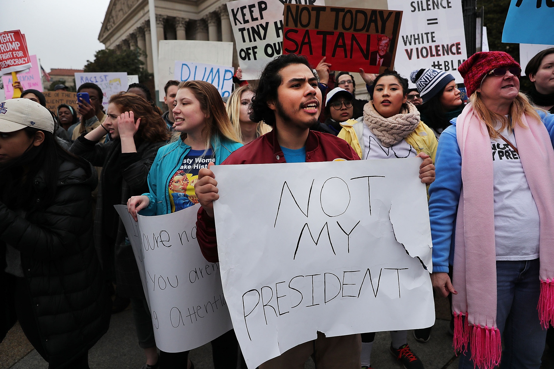 WASHINGTON, DC - JANUARY 20: Anti-Trump protesters demonstrate near the National Mall following the inauguration of President Donald Trump on January 20, 2017 in Washington, DC. Washington and the entire world have watched the transfer of the United States presidency from Barack Obama to Donald Trump, the 45th president.   Spencer Platt/Getty Images/AFP