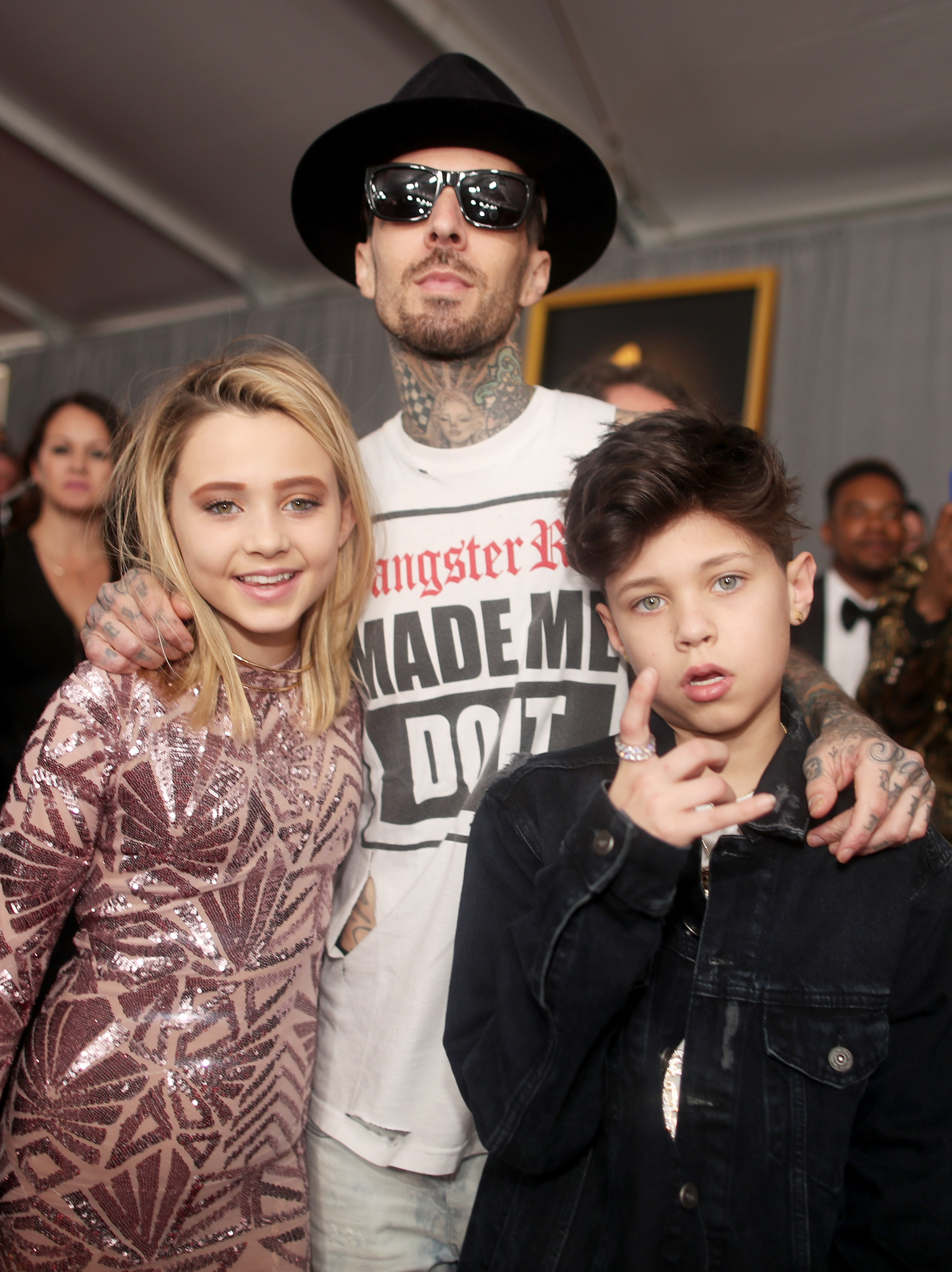 LOS ANGELES, CA - FEBRUARY 12: Musician Travis Barker of Blink-182 with children Alabama Barker and Landon Barker attend The 59th GRAMMY Awards at STAPLES Center on February 12, 2017 in Los Angeles, California. Christopher Polk/Getty Images for NARAS/AFP
