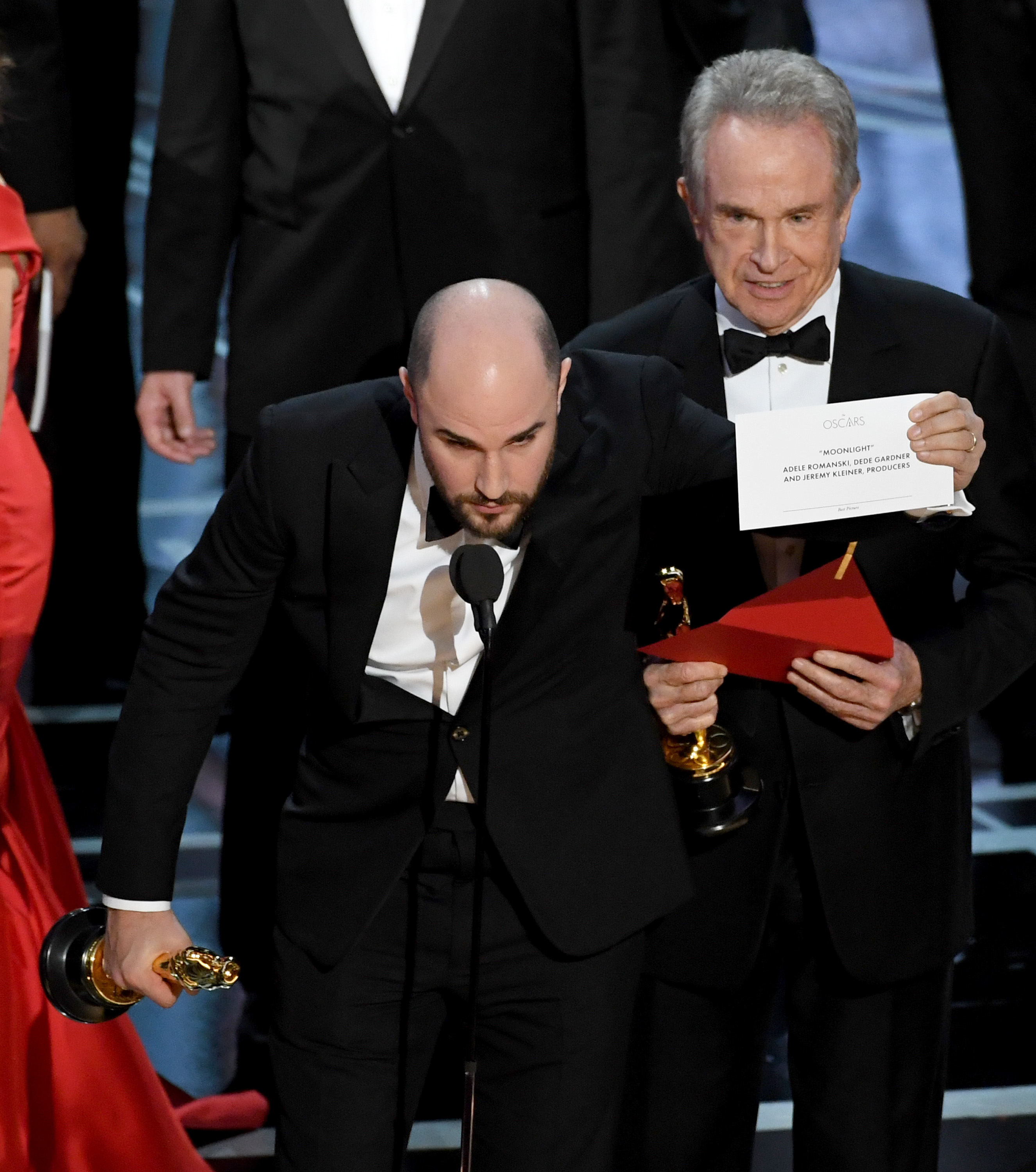 HOLLYWOOD, CA - FEBRUARY 26: 'La La Land' producer Jordan Horowitz (L) holds up the winner card reading actual Best Picture winner 'Moonlight' after a presentation error with actor Warren Beatty onstage during the 89th Annual Academy Awards at Hollywood & Highland Center on February 26, 2017 in Hollywood, California. Kevin Winter/Getty Images/AFP